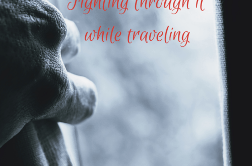 hand pulling back a curtain