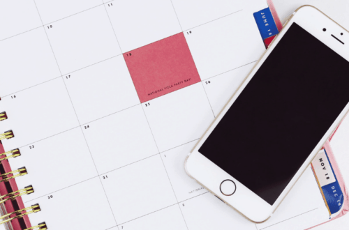 Monthly planner page with cell phone on top