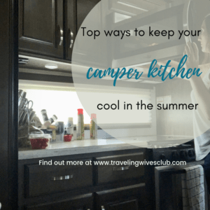Woman standing in small camper kitchen