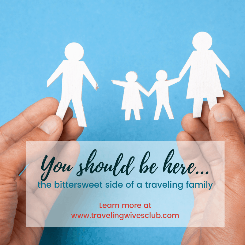 Two hands holding a paper cut-out family with father separated