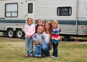 family outside camper