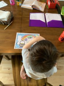 Child completing artwork at home